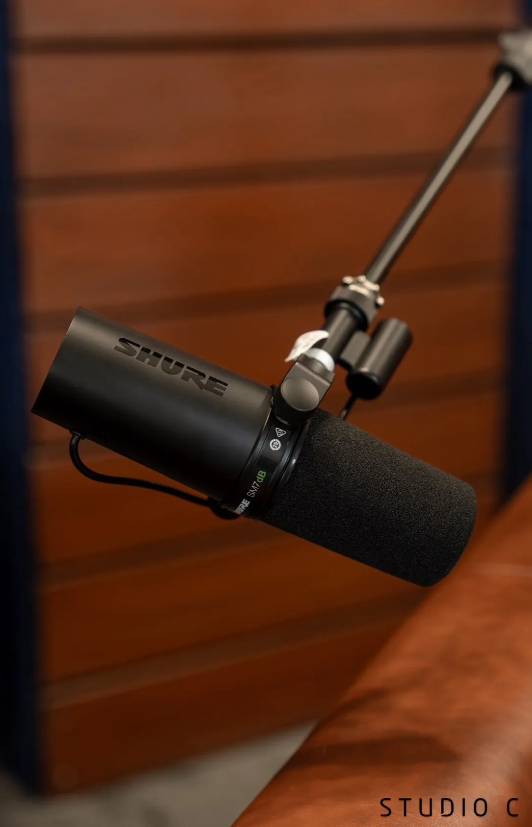 A Shure SM7dB microphone on a boom arm